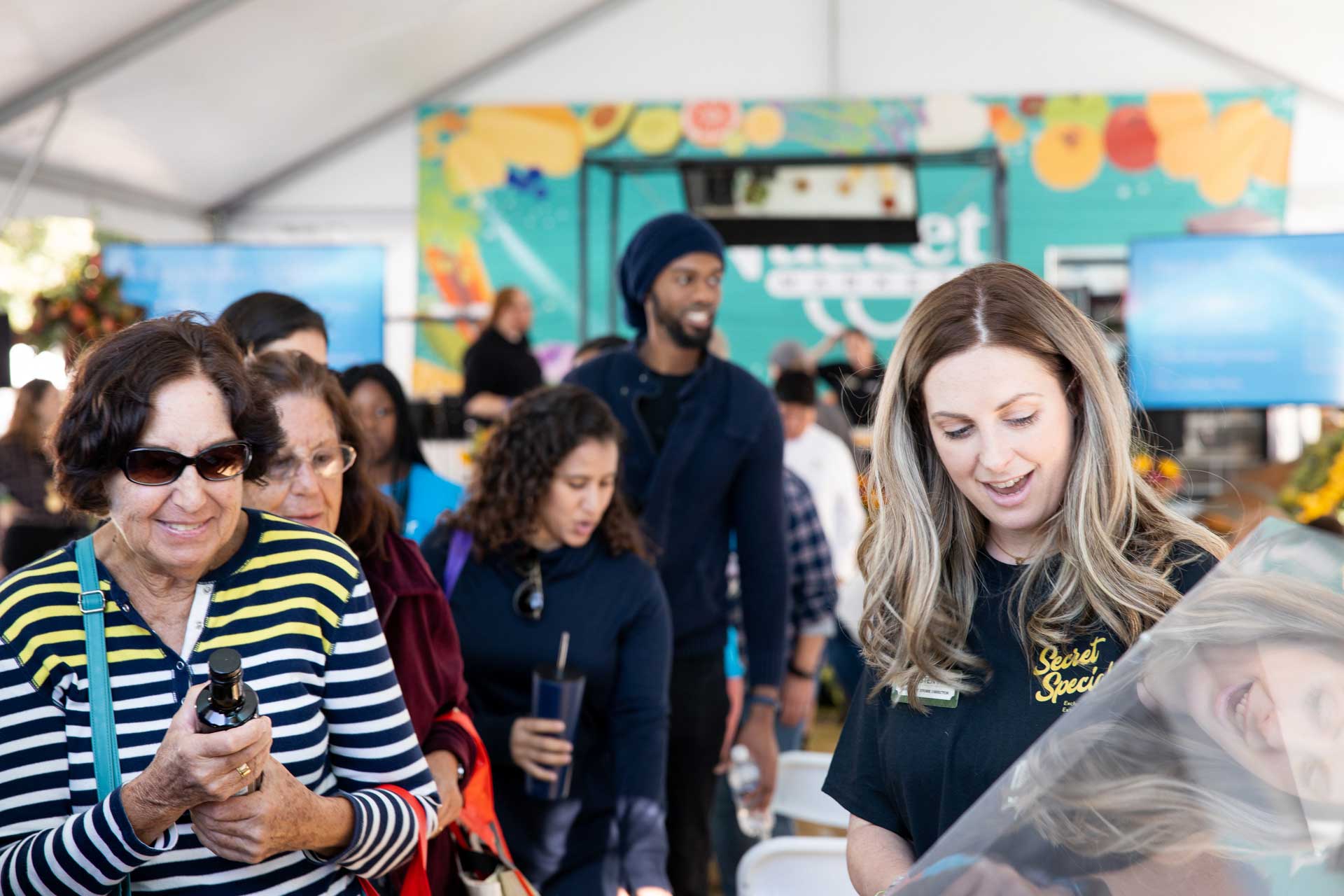 Nugget Markets associate helps guests at Farm to Fork event