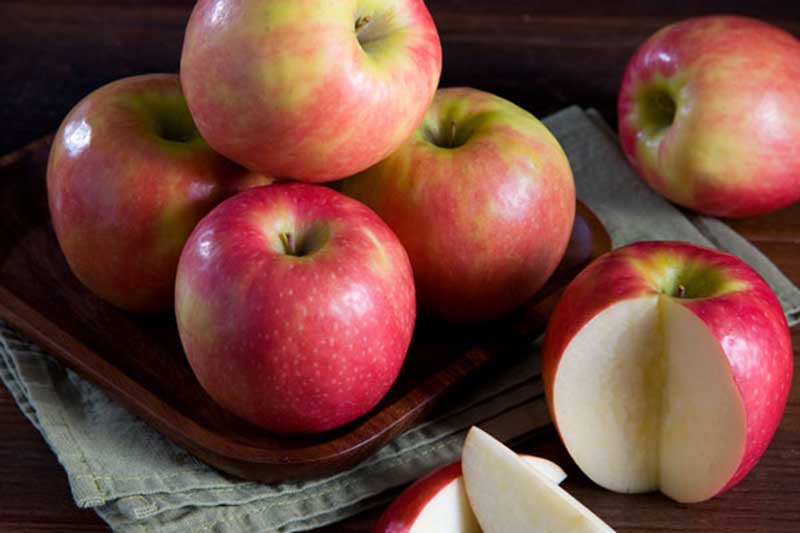 pink lady apples stacked