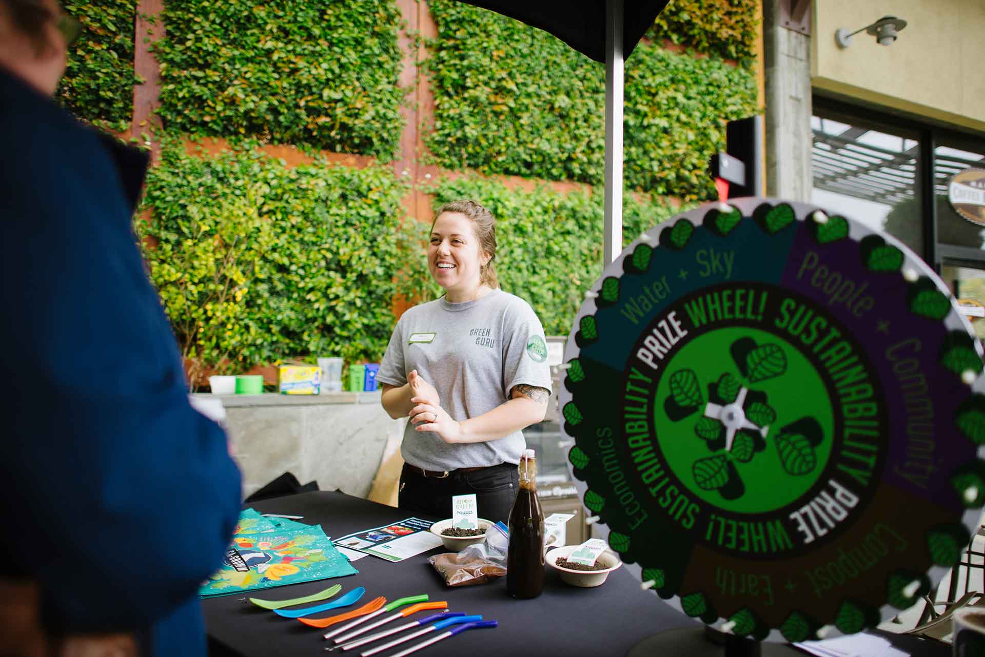 Shea Robinson next to the Sustainability Prize Wheel